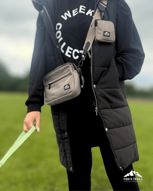 Dog owner wearing mushroom dog walking bag outdoors – Fido’s Trails