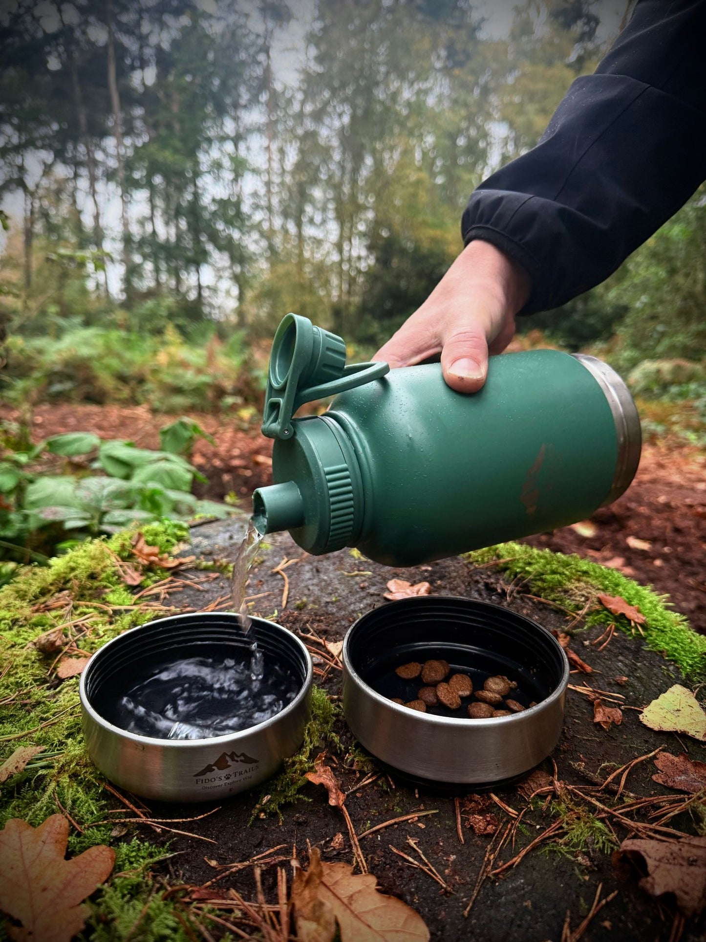 Stylish and practical 3-in-1 water bottle for dogs from Fido's Trails, featuring integrated bowls for hydration and snacks.