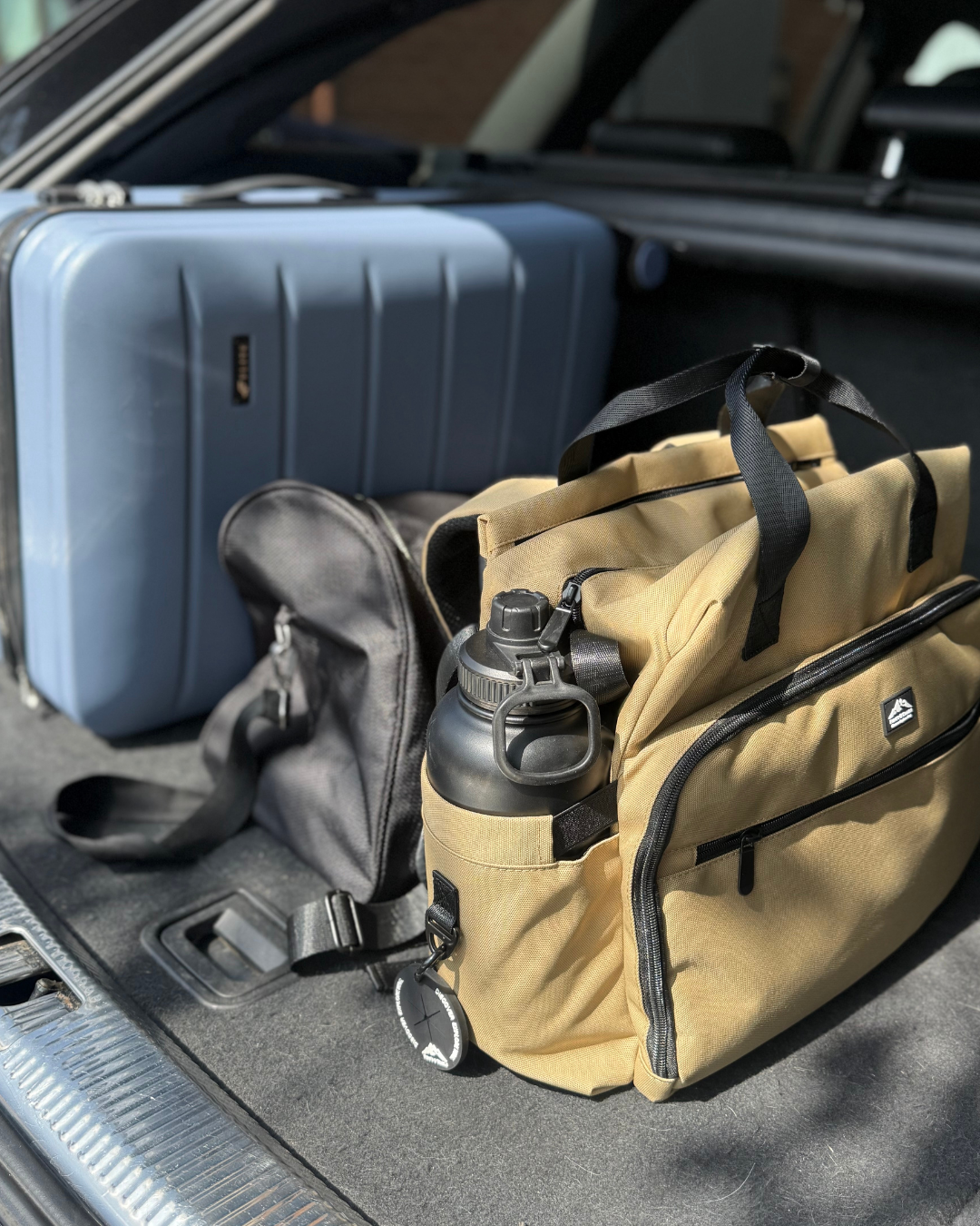 Dog travel bag packed in car boot for weekend trip, perfect for organised travel with your dog