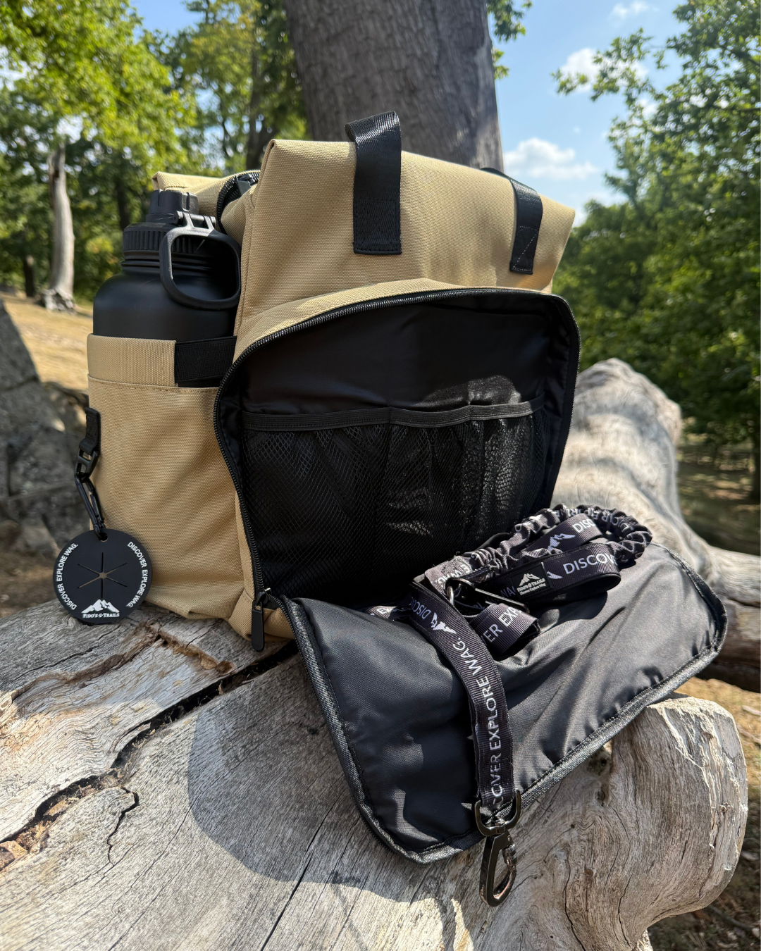 Inside of dog travel bag showing organised compartments for food, gear and essentials