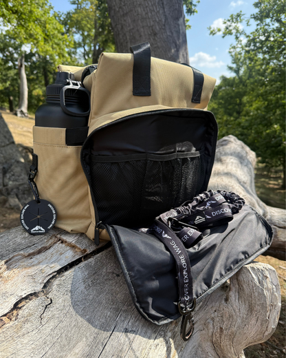 Inside of dog travel bag showing organised compartments for food, gear and essentials