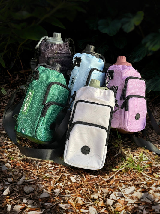 Dog water bottle bags with Contour Trail pattern in multiple colours, designed for hands-free walks and outdoor adventures