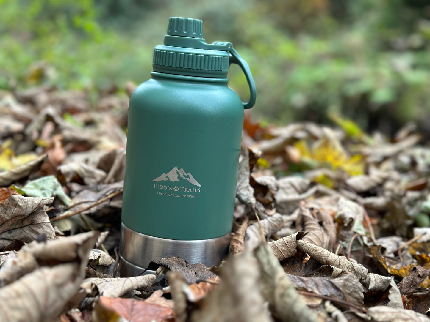 3-in-1 dog water bottle placed on ground in outdoor setting