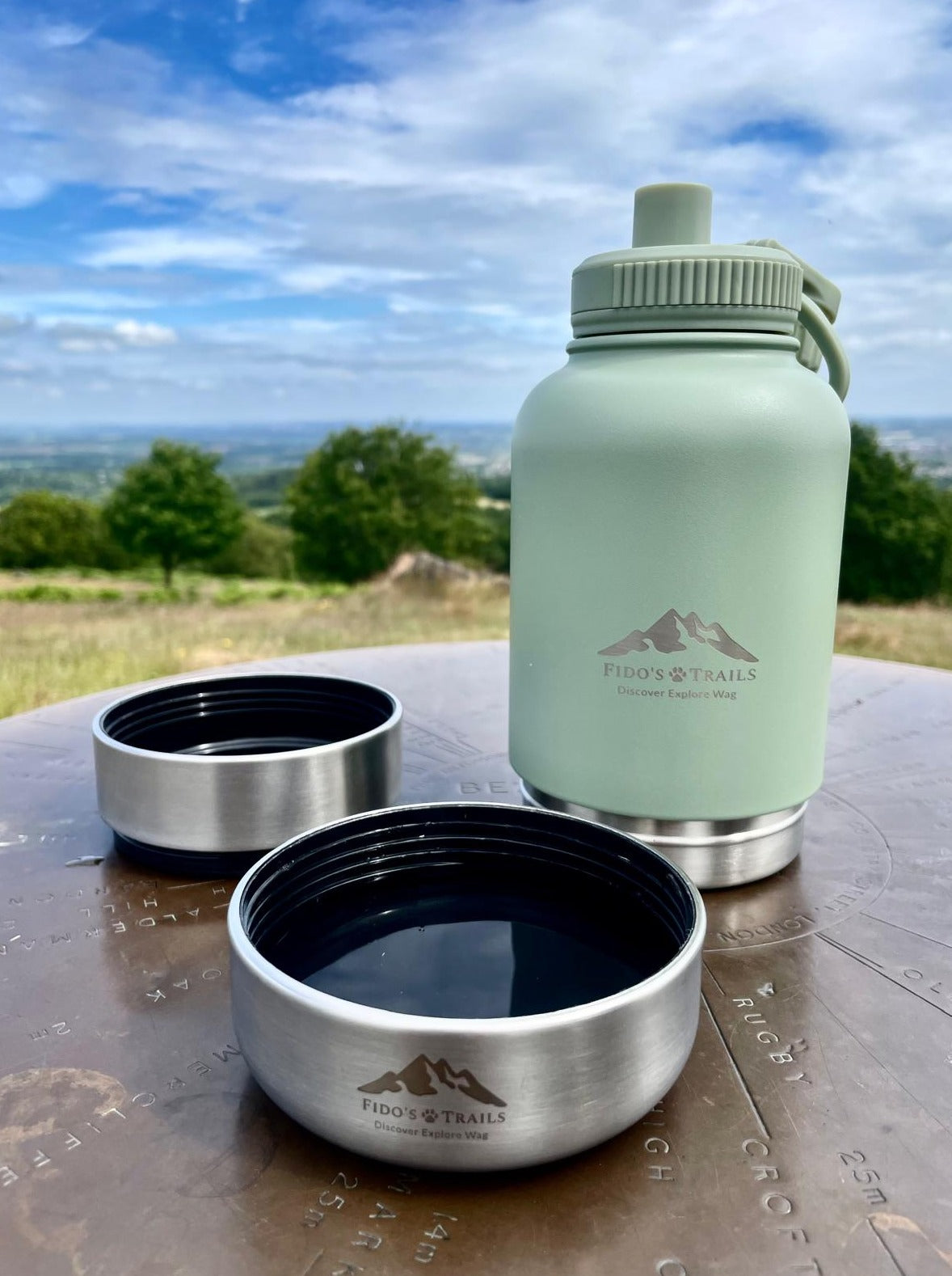 Sage 3-in-1 dog water bottle with detachable bowls placed outdoors